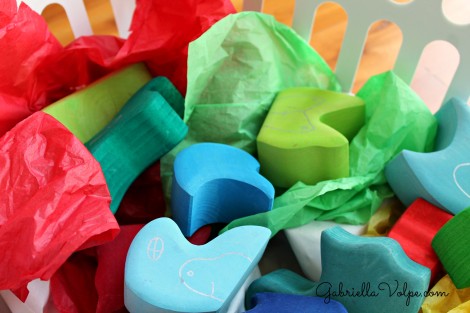 colorful wooden blocks and tissue paper in sensory box for disabled child
