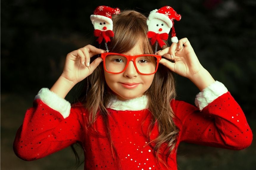 A white girl wearning holiday eye glasses - Adapting Christmas