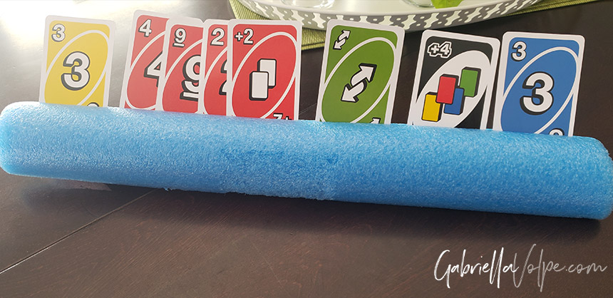 using a slotted pool noodle to hold the cards