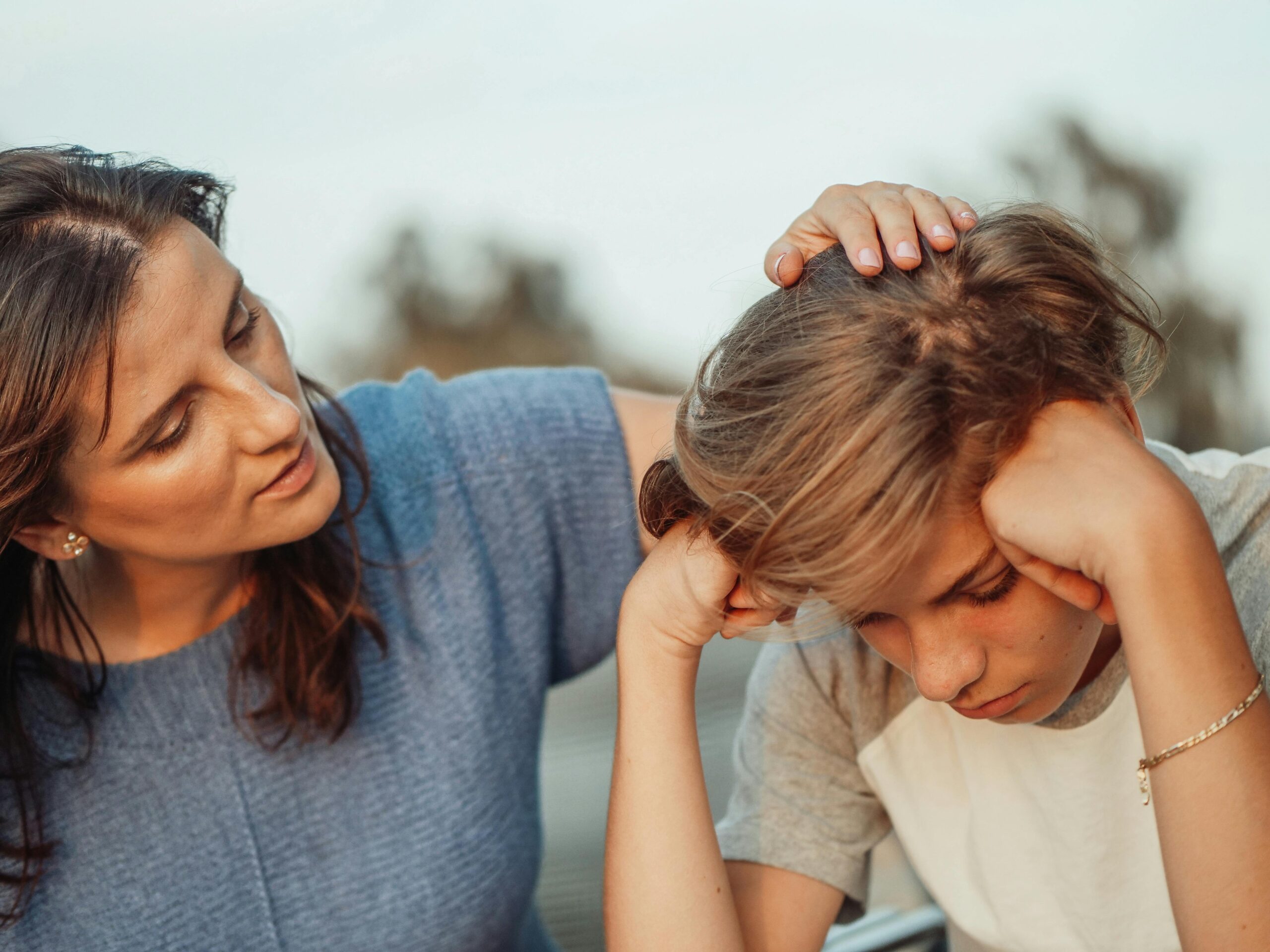 Adult comforting a child experiencing distress