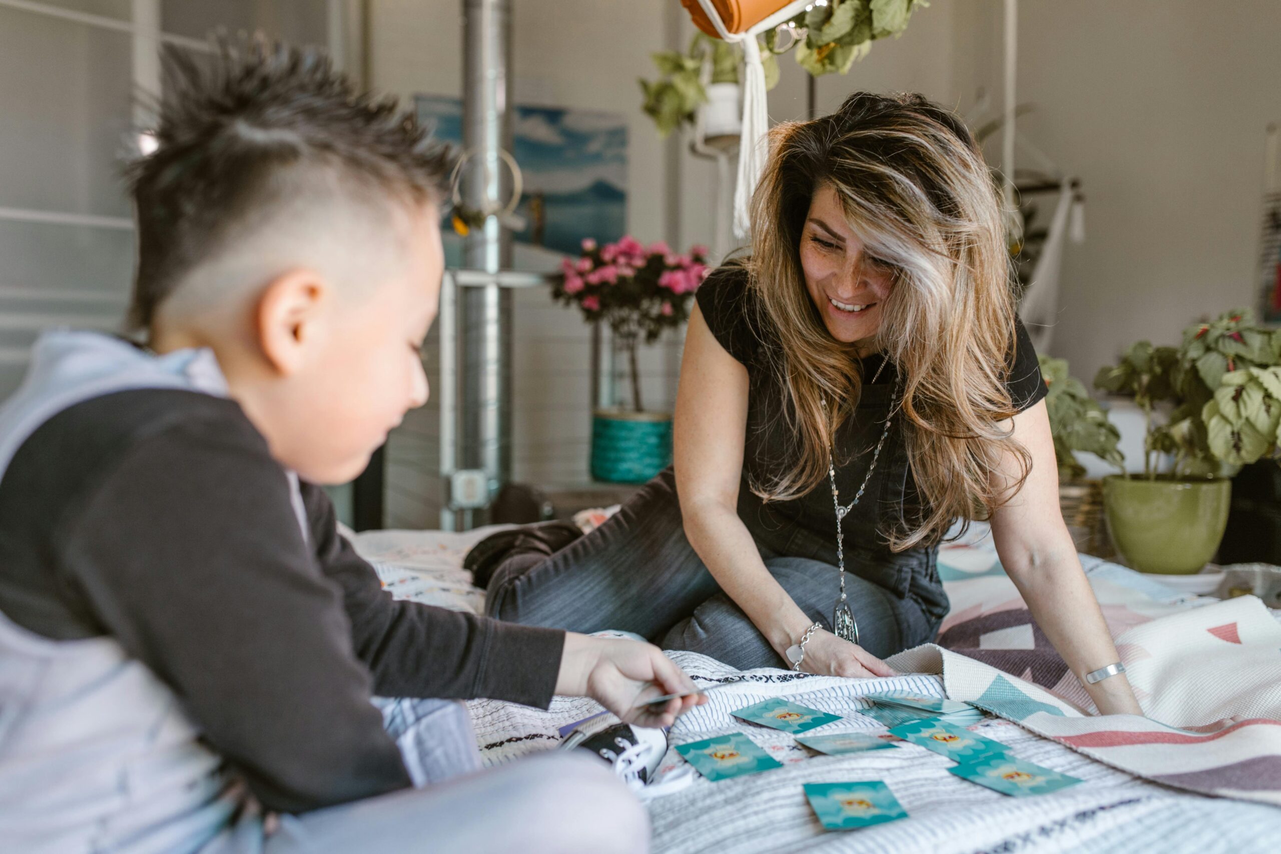 Learner and parent playing a game as part of unschooling